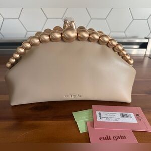 NWT Cult Gaia Una Clutch with Gold Beaded Handle, sand dollar